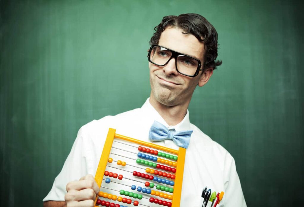 A 3-Stock TFSA Game Plan for the Rest of 2026 man in bowtie poses with abacus